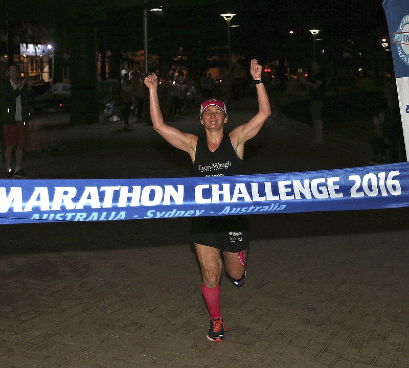 
              Becca Pizzi, of the United States, gets set to cross the finish line to win the seventh and final leg of the World Marathon Challenge, Saturday, Jan. 30, 2016, in Sydney, Australia. Pizzi, from Belmont, Mass., and Daniel Cartica, of Poughkeepsie, N.Y, won the World Marathon Challenge, completing seven marathons in seven days on all seven continents. (AP Photo/Rob Griffith)
            