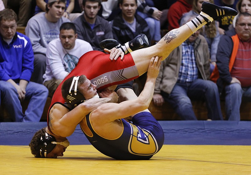 Staff Photo by Dan Henry / The Chattanooga Times Free Press- 1/15/16. UTC's Dominic Lampe wrestles Garner-Webb's Kyle Ash in the 165-lb weight class at Maclellan Gymnasium on Friday, January 15, 2016. Lampe won the bout. 