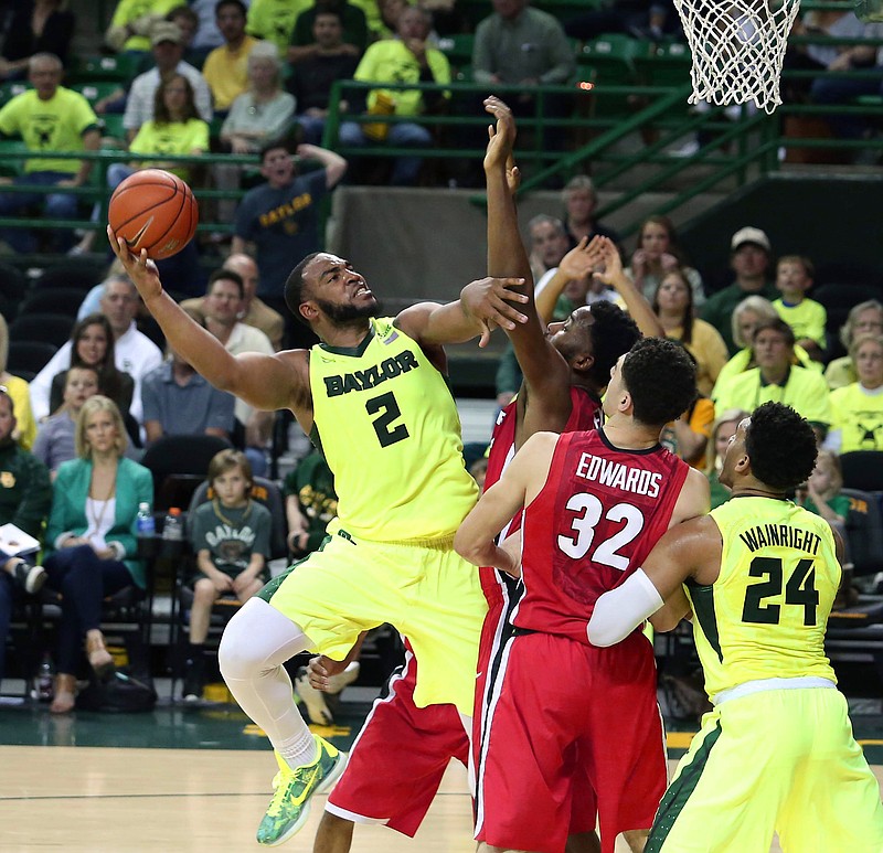 Baylor forward Rico Gathers (2) shoots past Georgia forward Yante Maten (1) and forward Mike Edwards (32) in the second half of an NCAA college basketball game, Saturday, Jan. 30, 2016, in Waco, Texas. Baylor won 83-73. (Rod Aydelotte/Waco Tribune Herald, via AP)