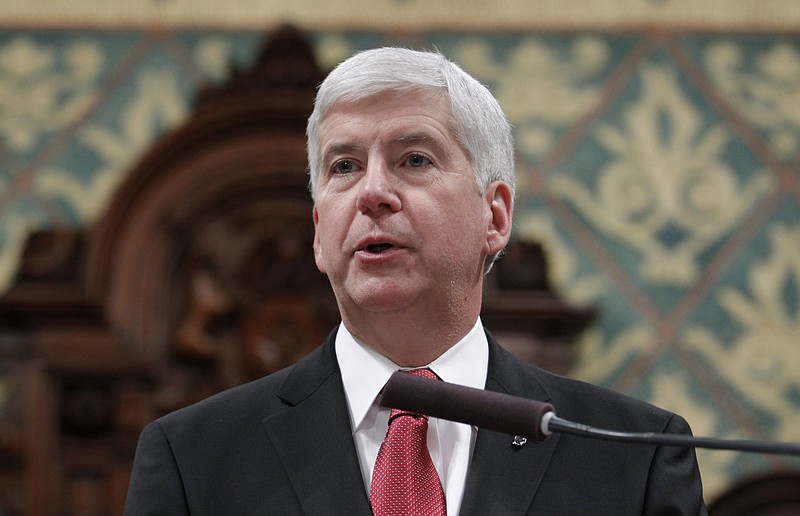 
              FILE - In a Tuesday, Jan. 19, 2016 file photo,Michigan Gov. Rick Snyder delivers his State of the State address to a joint session of the House and Senate, at the state Capitol in Lansing, Mich. Snyder has released some, but not all, of his government emails related to Flint’s water emergency. The 274 pages cover 2014 and 2015. That includes the 18-month period during which the city switched its water source while under state financial management until it reconnected to Detroit’s system because of lead contamination blamed on state regulatory failures.  Snyder has withheld the emails of others in the executive office along with his own emails from earlier.  (AP Photo/Al Goldis, File)
            