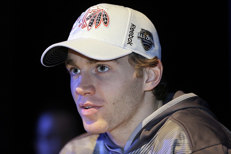 
              Chicago Blackhawks forward Patrick Kane answers questions during NHL hockey All-Star game media day Friday, Jan. 29, 2016, in Nashville, Tenn. The game is scheduled to be played Sunday, Jan. 31. (AP Photo/Mark Humphrey)
            