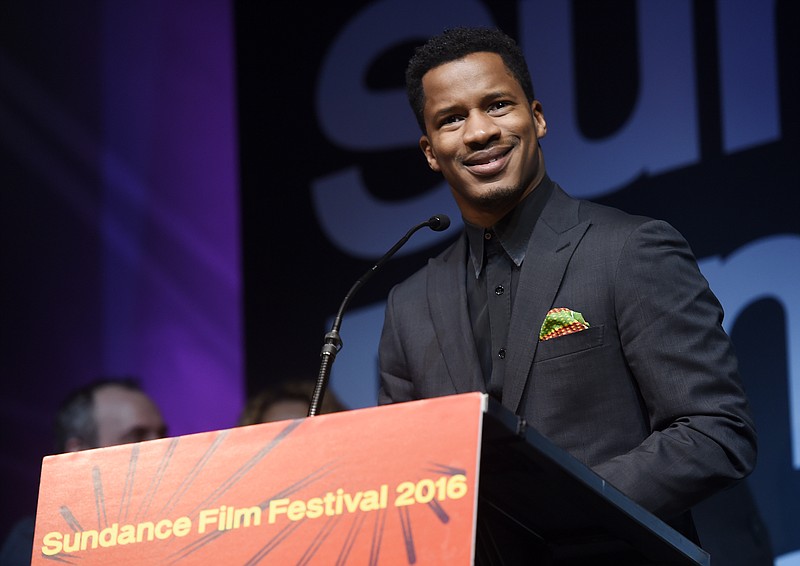 
              Nate Parker, the star, director and producer of "The Birth of a Nation," accepts the U.S. Dramatic Audience Award for his film during the 2016 Sundance Film Festival Awards Ceremony on Saturday, Jan. 30, 2016, in Park City, Utah. The film also won the U.S. Grand Jury Prize: Dramatic award. (Photo by Chris Pizzello/Invision/AP)
            