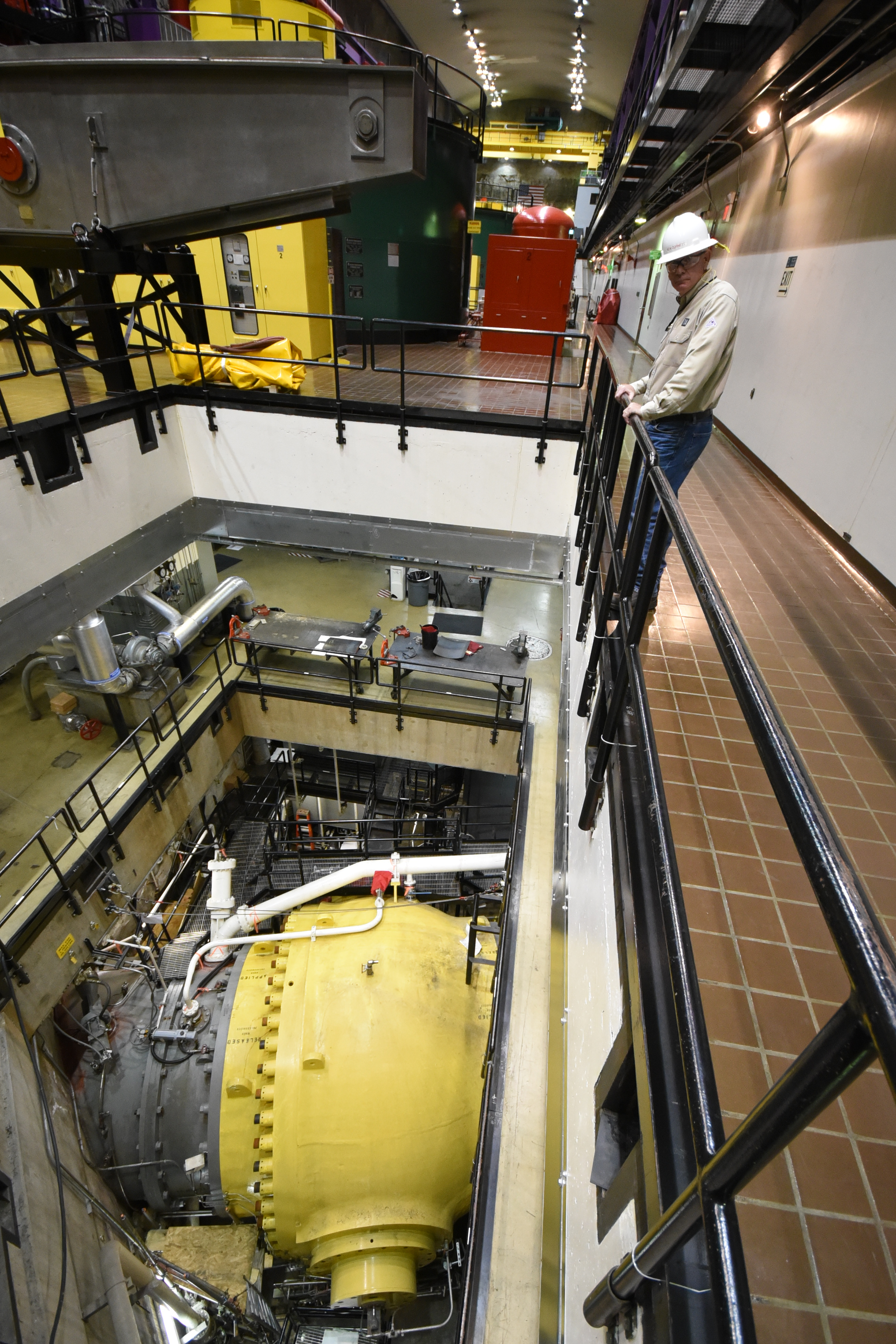 Ken Cornett, plant manager at the Tennessee Valley Authority's Raccoon Mountain Pumped Storage Facility, looks down at the 10-foot-wide ball valve that is opened and closed to let water in and out of the reservoir.