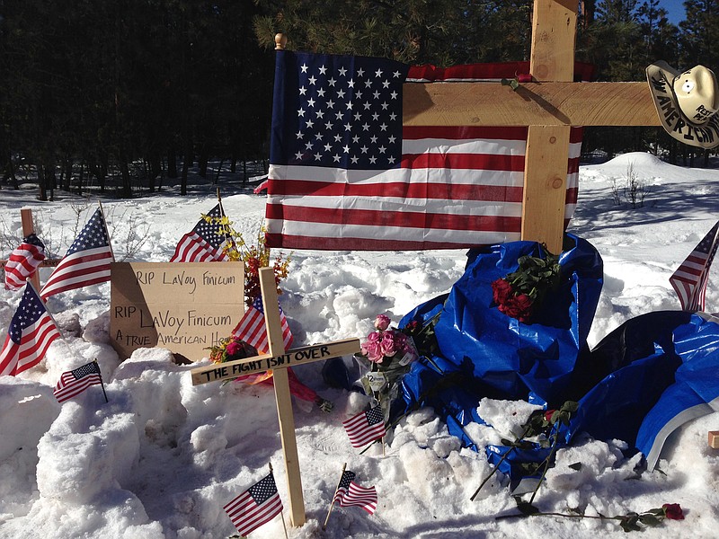 
              A makeshift roadside memorial for rancher LaVoy Finicum stands on a highway north of Burns, Oregon Sunday, Jan. 31, 2016. Finicum was killed Tuesday night in a confrontation with the FBI and Oregon State Police on a remote road. Four people occupying the Malheur National Wildlife Refuge held their position Sunday. They have demanded that they be allowed to leave without being arrested. (AP Photo/Nick K. Geranios)
            