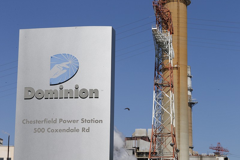 
              FILE - This Wednesday, April 29, 2015, file photo, shows Dominion Power's coal fired power plant along the James River in Chester, Va. Dominion Resources announced Monday, Feb. 1, 2016, that it is buying Questar for approximately $4.4 billion, a big reach to the West for the East coast energy company. (AP Photo/Steve Helber)
            