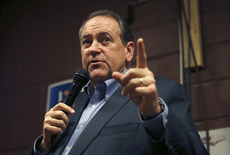 In this Jan. 31, 2016, photo, Republican presidential candidate, former Arkansas Gov. Mike Huckabee speaks at Inspired Grounds Cafe in West Des Moines, Iowa. Huckabee says on Twitter on Feb. 1, 2016, he's ending his run for president. 