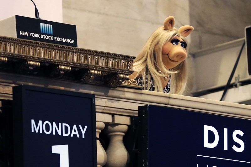 
              Miss Piggy overlooks the New York Stock Exchange trading floor after ringing the opening bell to highlight the season premier of Disney's "The Muppets" television show, Monday, Feb. 1, 2016. (AP Photo/Richard Drew)
            