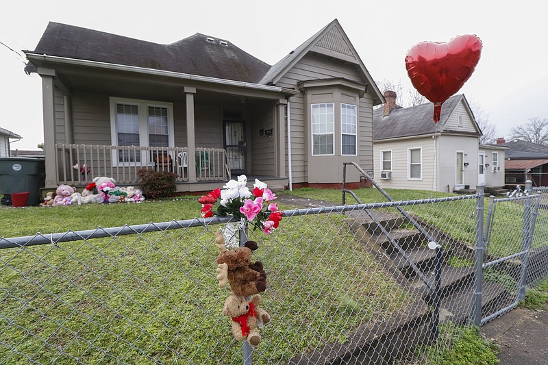 Staff Photo by Dan Henry / The Chattanooga Times Free Press- 2/2/16. A memorial is set up at  2106 E. 13th Street where a five-year-old had to call and report the shooting death of both his parents late Sunday evening. 