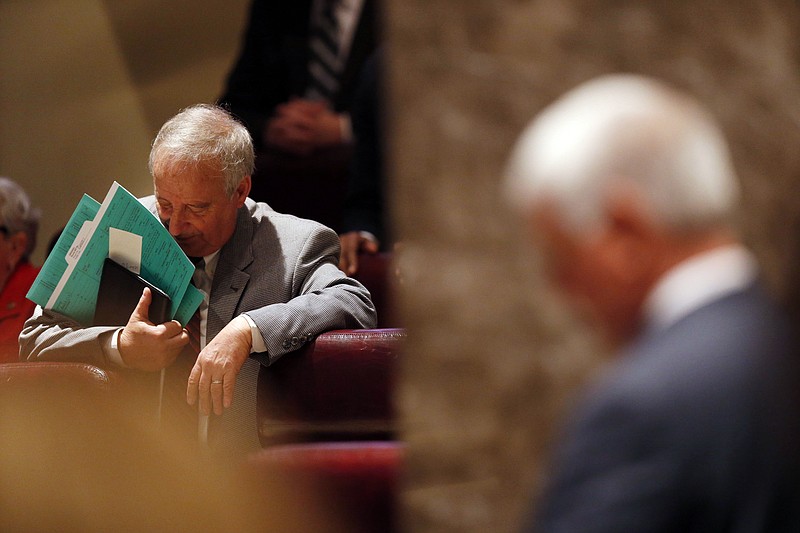Rep. Mike Ball rests his arm on a chair during the legislature session start Tuesday, Feb. 2, 2016, in Montgomery, Ala.