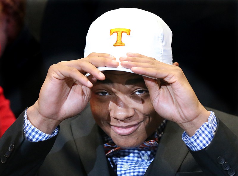 Nigel Warrior, a safety from Peachtree Ridge High School, dons a University of Tennessee cap as he commits to the Vols during national signing day at the College Football Hall of Fame, Wednesday, Feb, 3, 2016, in Atlanta. (Curtis Compton/Atlanta Journal-Constitution via AP)  MARIETTA DAILY OUT; GWINNETT DAILY POST OUT; LOCAL TELEVISION OUT; WXIA-TV OUT; WGCL-TV OUT; MANDATORY CREDIT 