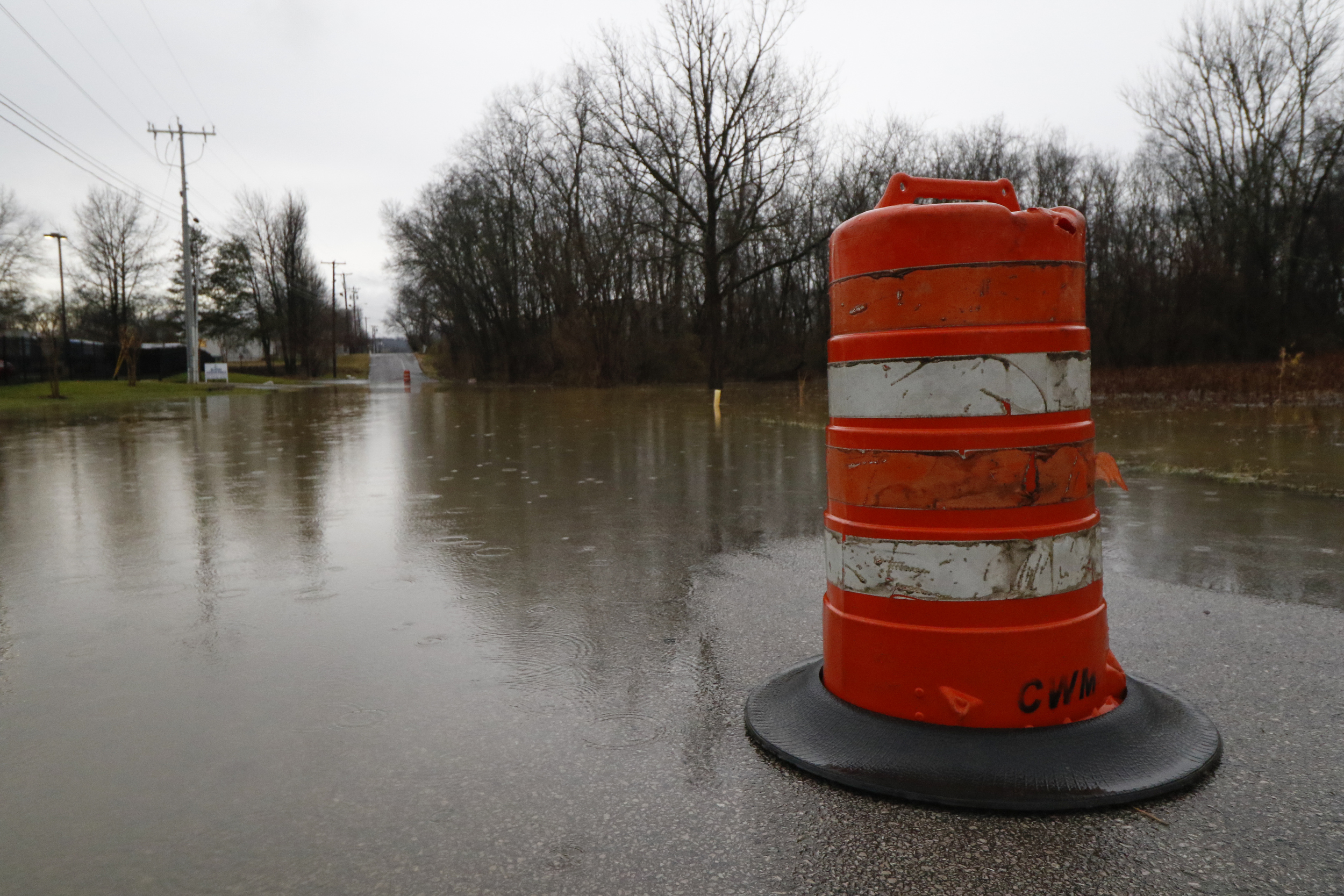 Staff Photo by Dan Henry / The Chattanooga Times Free Press- 2/3/16. Motorists make their way through standing water covering Appling Street on Wednesday, February 3, 2016, after overnight rains flooded the area.