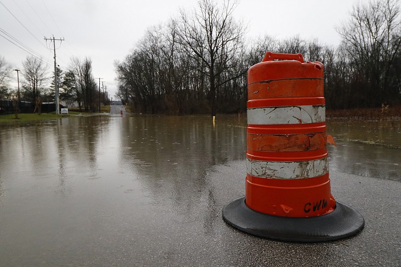Staff Photo by Dan Henry / The Chattanooga Times Free Press- 2/3/16. Motorists make their way through standing water covering Appling Street on Wednesday, February 3, 2016, after overnight rains flooded the area. 