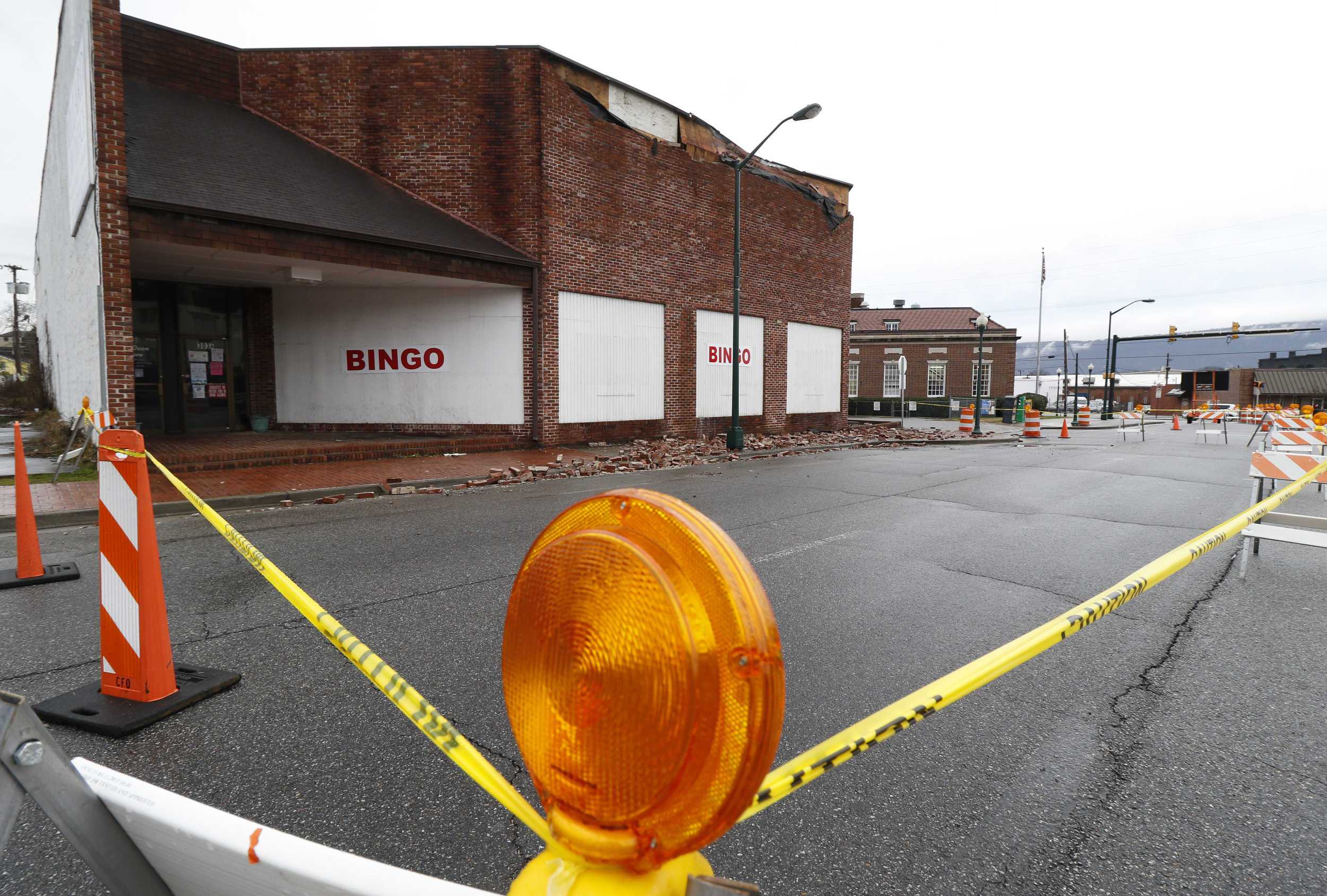Staff Photo by Dan Henry / The Chattanooga Times Free Press- 2/3/16. Traffic is diverted just south of the State line on Wednesday, February 3, 2016, after overnight rains brought down a part of the Bingo hall's wall in Rossville, Ga.