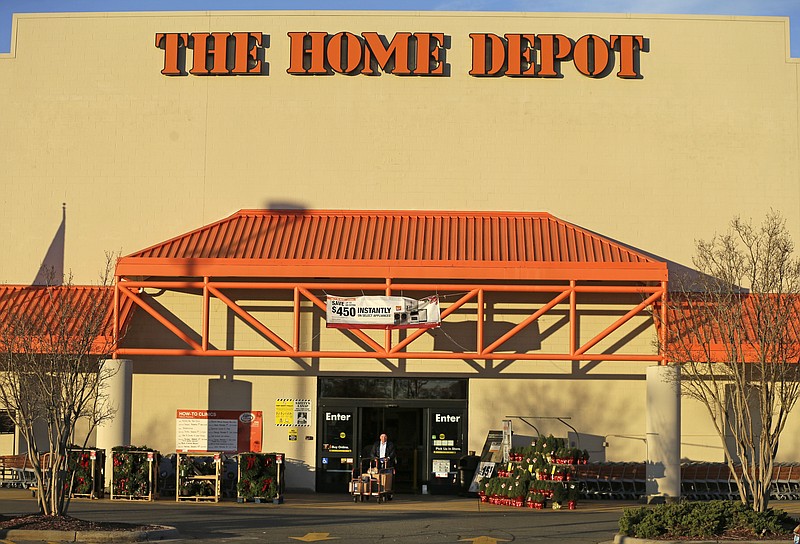 
              FILE - In this Nov. 18, 2014 file photo, a customer leaves at a Home Depot store in Matthews, N.C. The nation's largest home improvement chain, based in Atlanta, said Wednesday, Feb. 3, 2016,  it's hiring more than 80,000 workers nationwide for its busy spring season, the same level as in recent years. The retailer estimates that more than half of the temporary workers stay on for permanent employment. (AP Photo/Chuck Burton)
            