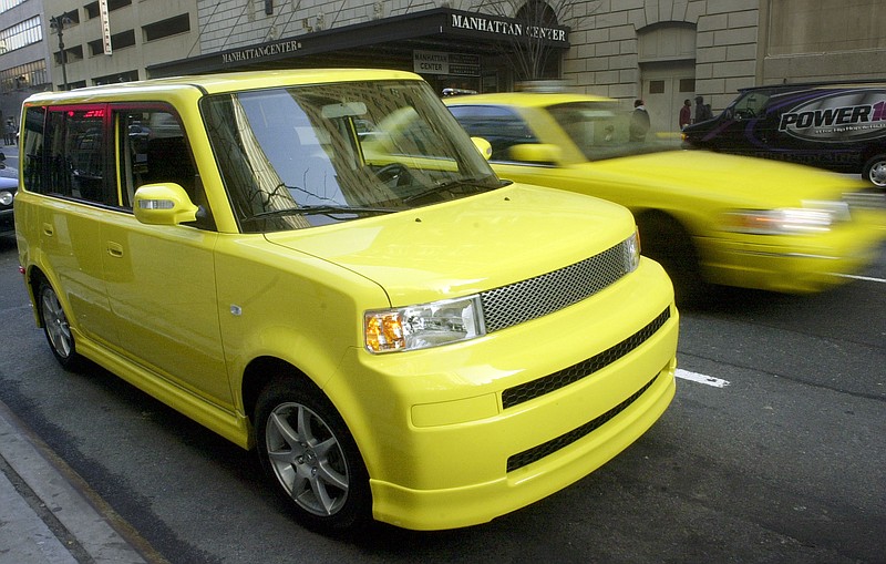
              FILE - In this Saturday, April 16, 2005, file photo, a solar yellow Scion limited-production xB Release Series 2.0 is parked in Manhattan as part of a corporate promotion in New York. Toyota announced Wednesday, Feb. 3, 2016, that it is discontinuing its Scion brand, aimed at younger car buyers, after years of slumping sales. Scion owners can still visit Toyota service departments for maintenance and repairs. (AP Photo/Mark Lennihan, File)
            