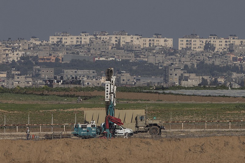 
              Israeli drills search for fighting tunnels on the Israel and  Gaza border, seen in the background, Wednesday, Feb. 3, 2016. Hamas has built a sophisticated network of tunnels that it has used to penetrate Israel to carry out attacks on civilians and soldiers. Israel destroyed dozens of the tunnels in the war with the militant group in Gaza in 2014. (AP Photo / Tsafrir Abayov)
            