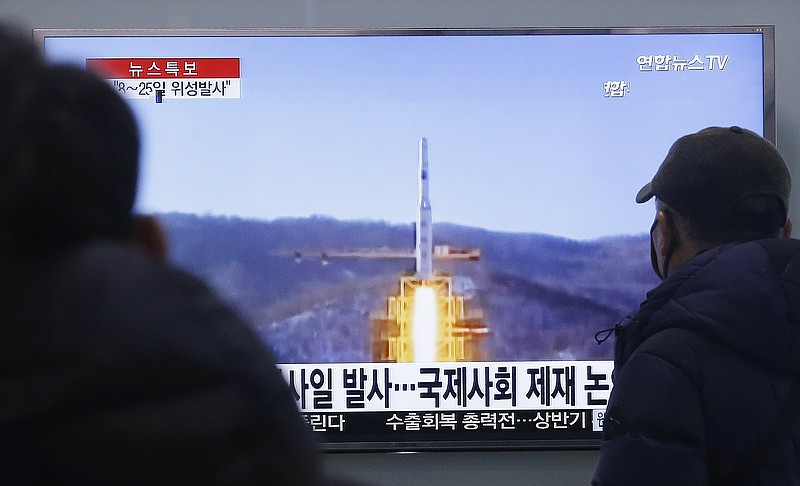 
              South Koreans watch a TV news program with a file footage about North Korea's rocket launch plans, at Seoul Railway Station in Seoul, South Korea, Wednesday, Feb. 3, 2016. South Korea warned on Wednesday of "searing" consequences if North Korea doesn't abandon plans to launch a long-range rocket that critics call a banned test of ballistic missile technology.  The headline on the screen reads "North Korea plans to launch a missile." (AP Photo/Ahn Young-joon)
            
