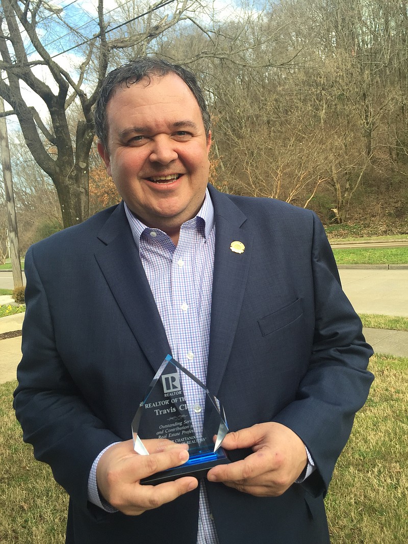 Travis Close poses with a trophy honoring him as Chattanooga's Realtor of the year