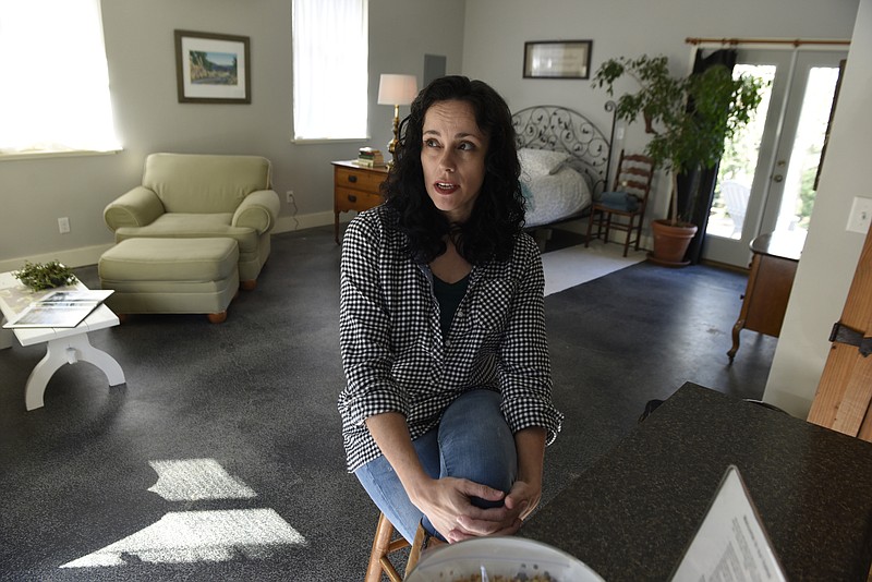 Missy Luce is photographed at her Airbnb unit on Thursday, Feb. 3, 2016, in Chattanooga. Converted from an attached garage at her family's house, the rental unit includes a kitchen, bathroom, seating area and a bed.