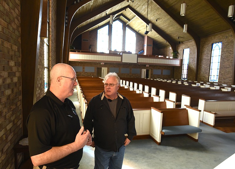 Paul Lee, left, and Jimmy Meeks set up for the Sheepdog seminar Friday, January 29, 2016 at Brainerd Hills Baptist Church.