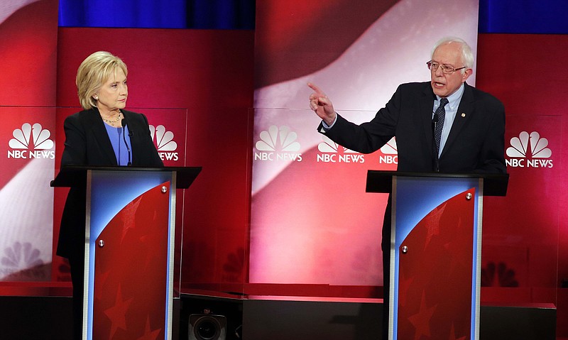 Democratic presidential candidate, Sen. Bernie Sanders, I-Vt., gestures towards Democratic presidential candidate, Hillary Clinton during the NBC, YouTube Democratic presidential debate at the Gaillard Center on Jan. 17.