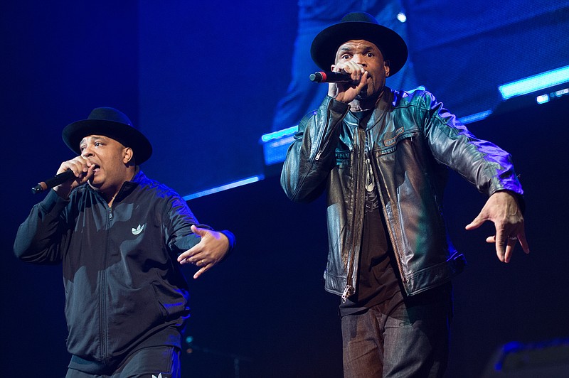 
              FILE - In this Dec. 19, 2014 file photo, Joseph Simmons, left, and Darryl McDaniels of Run DMC perform at Christmas in Brooklyn at the Barclays Center in the Brooklyn borough of New York. Run DMC is expected to open for the Red Hot Chili Peppers at the sixth-annual DirecTV Super Saturday Night concert in San Francisco the night before the Super Bowl. (Photo by Scott Roth/Invision/AP, File)
            