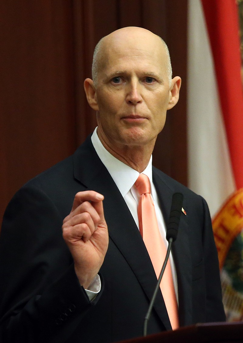 
              File-This March 3, 2015, file photo shows Florida Gov. Rick Scott emphasizing a point in his State of the State speech on the opening day of a joint session of the legislature in Tallahassee, Fla.  Scott called for more vigilance Thursday, Feb. 4, 2016, against the Zika virus and he said his emergency health declaration for five counties was much like getting ready for hurricane. He sought to assure people that Florida, a hub for cruises and flights to Central and South America where the outbreak is, was safe. (AP Photo/Steve Cannon, File)
            