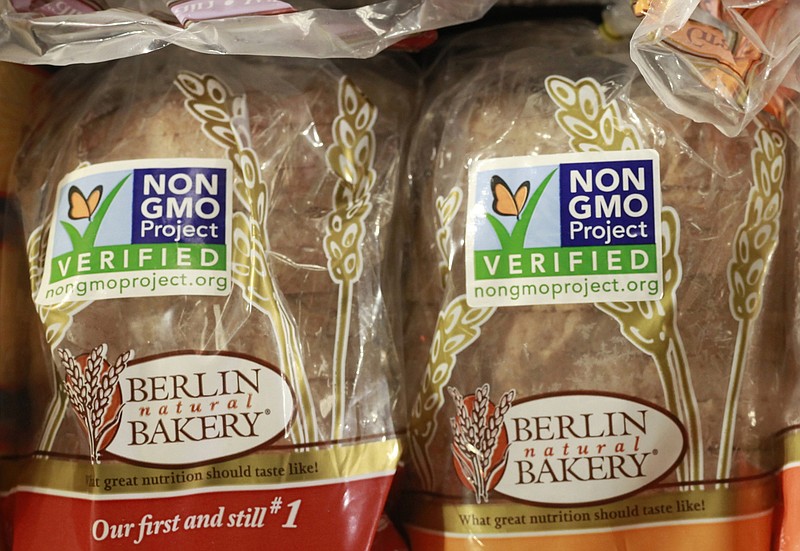 
              FILE - In this Oct. 5, 2012, file photo. froducts labeled with Non Genetically Modified Organism (GMO) are sold at the Lassens Natural Foods & Vitamins store in Los Feliz district of Los Angeles. The food industry is pressuring Congress to act before the state of Vermont requires food labels for genetically modified ingredients. (AP Photo/Damian Dovarganes, File)
            