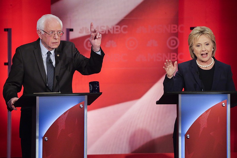 Democratic presidential candidate, Sen. Bernie Sanders, I-Vt, reacts to Democratic presidential candidate, Hillary Clinton's answer to a question during a Democratic presidential primary debate hosted by MSNBC at the University of New Hampshire Thursday, Feb. 4, 2016, in Durham, N.H.