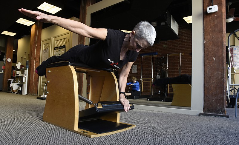 Colleen Carboni exercises at her studio, Pilates Chattanooga, in the Warehouse Row complex on Thursday, Feb. 3, 2016, in Chattanooga, Tenn. 