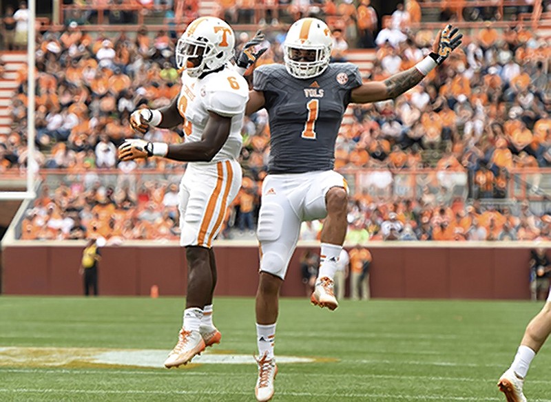 Tennessee running backs Alvin Kamara (6) and Jalen Hurd (1) celebrate after Kamara's touchdown during the NCAA college football team's Orange & White game at Neyland Stadium on Saturday, April 25, 2015, in Knoxville, Tenn. (Adam Lau/Knoxville News Sentinel via AP)