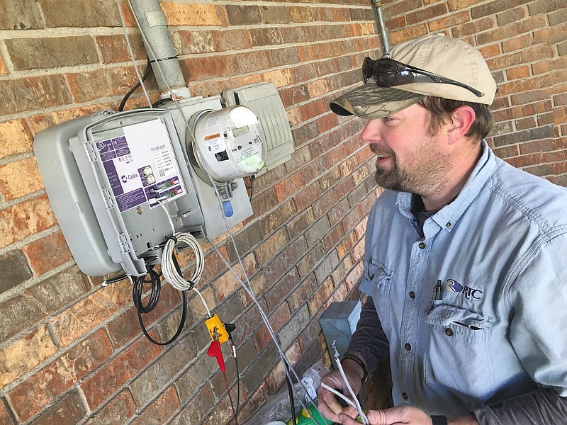 RTC Installer Scotty Carroll connects fiber-optic Internet at a Ringgold-area home.