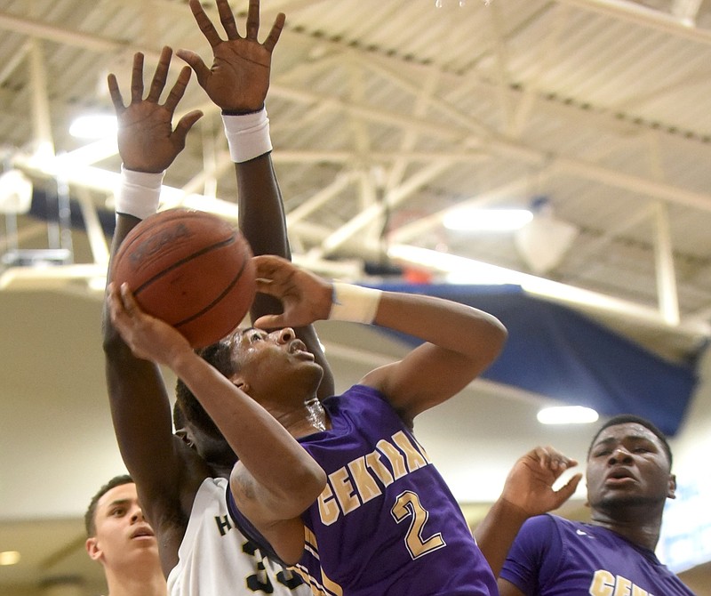 Central's Jamichael Poole is guarded by Hamilton Heights' Silas Adheke Friday, February 5, 2016 at McCallie.