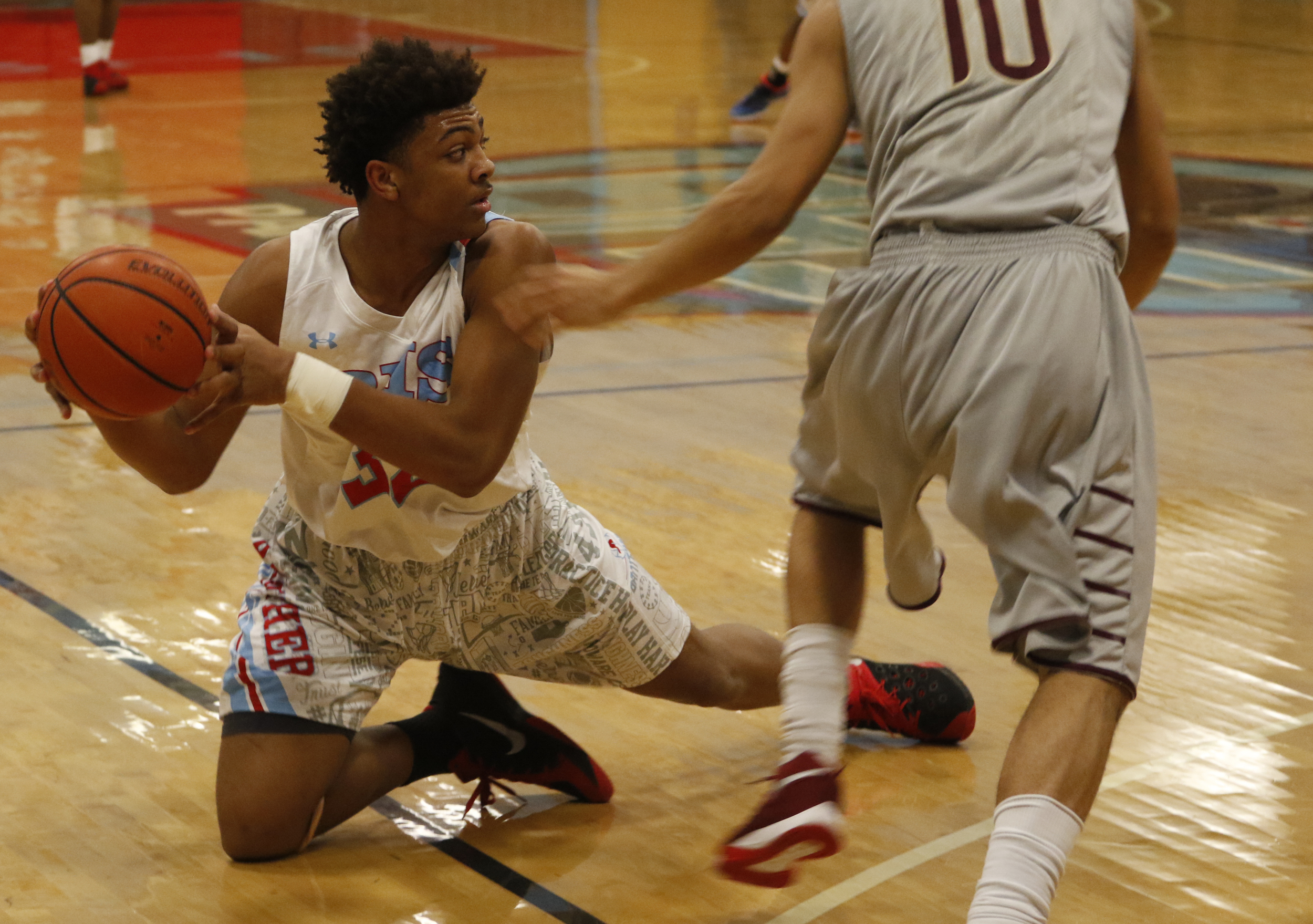 Brainerd's Jesse Walker looks to unload the ball under pressure from Tyner's John Boyd during Friday's game at High-Jackson Gymnasium.