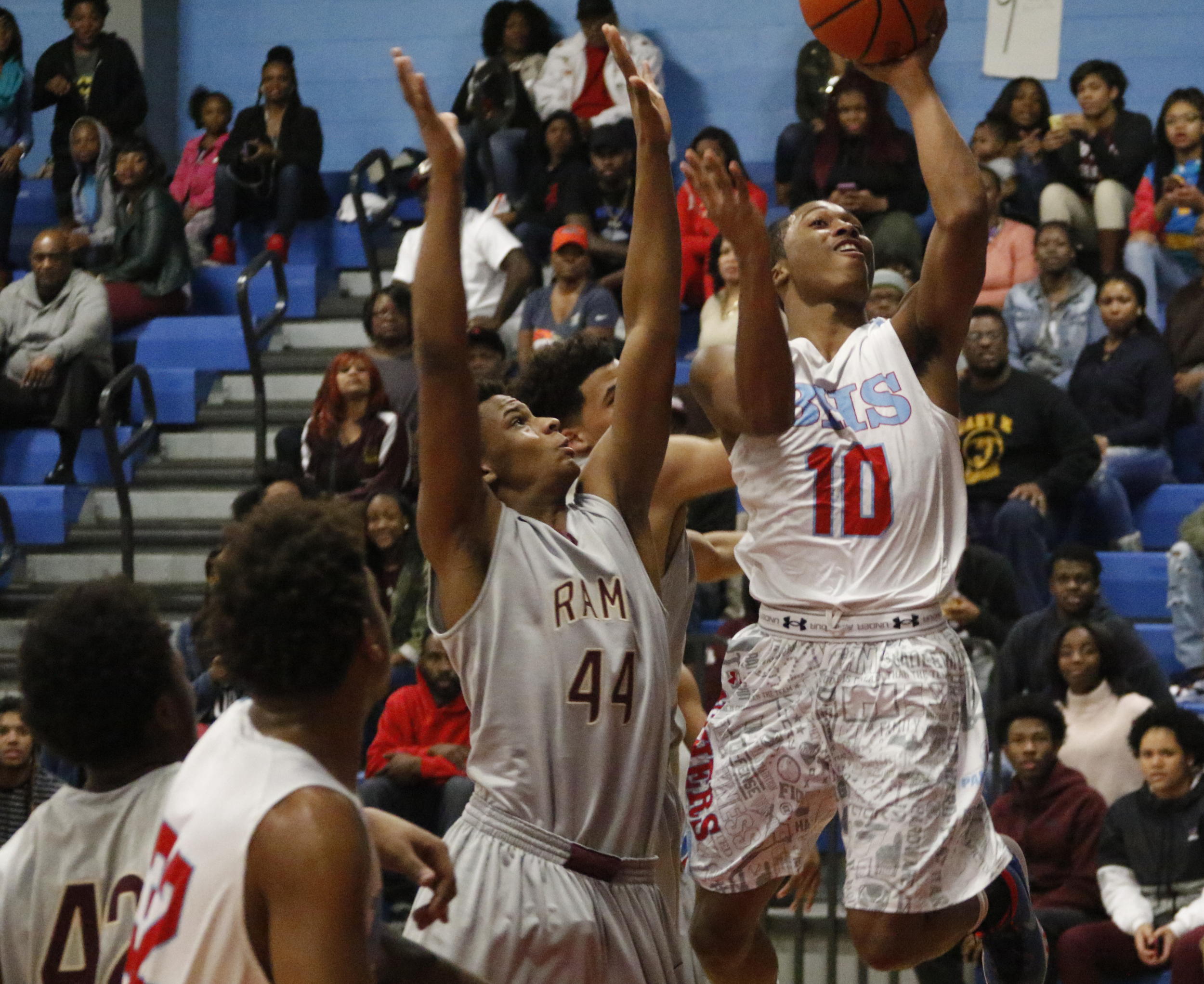 Staff Photo by Dan Henry / The Chattanooga Times Free Press- 2/5/16. Brainerd's Kentrell Evans (10) performs a layup as Tyner's Soloman Bridgeman (44) defends on Friday, February 5, 2016.