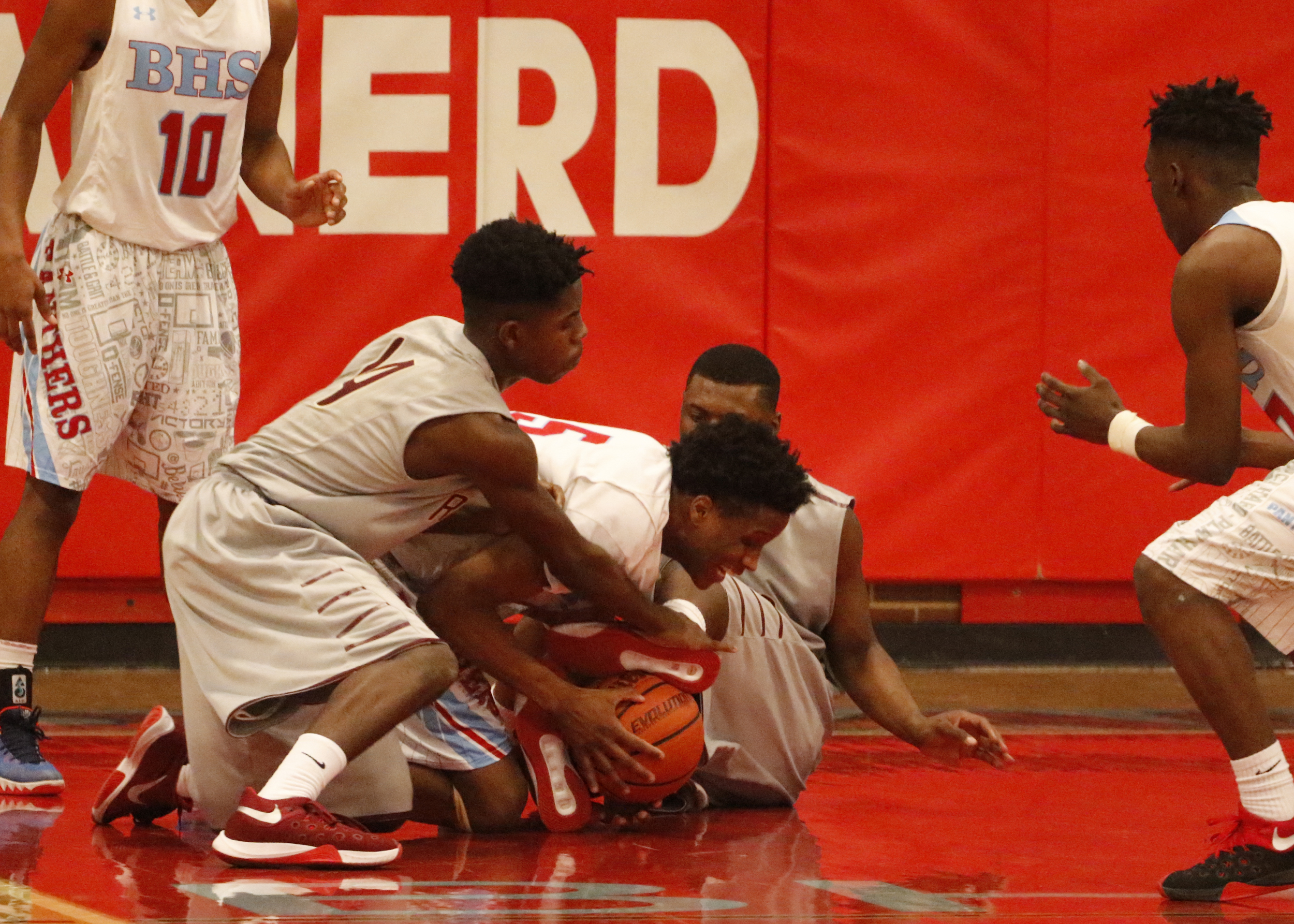Staff Photo by Dan Henry / The Chattanooga Times Free Press- 2/5/16. Brainerd's Dajonta Ross (5) fights Tyner's Jaylan Bowens (14) and Shannon Sprawls (50) for possession of a loose ball on Friday, February 5, 2016.