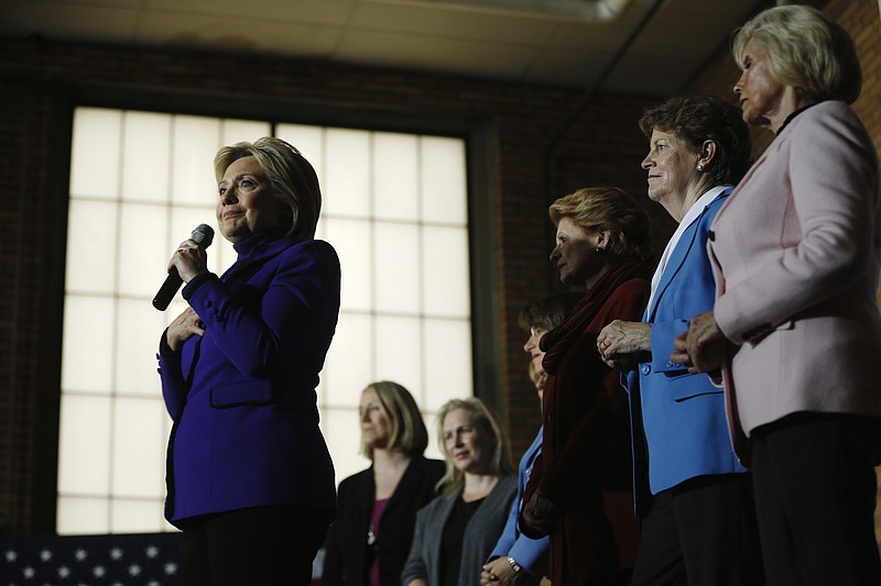 
              Democratic presidential candidate Hillary Clinton, accompanied by, from right, Lilly Ledbetter, right, Sen. Jeanne Shaheen, D-N.H., Sen. Debbie Stabenow, D-Mich., Sen. Amy Klobuchar, D-Minn., and others, speaks during a campaign stop, Friday, Feb. 5, 2016, in Manchester, N.H. (AP Photo/Matt Rourke)
            