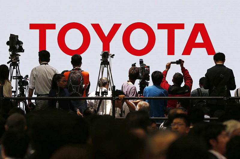 
              FILE - In this Oct. 28, 2015, file photo, Toyota Motor Corp.'s booth is crowded with visitors in the media preview of the Tokyo Motor Show in Tokyo. On Friday, Feb. 5, 2016, Toyota Motor Corp. reports financial results. (AP Photo/Shuji Kajiyama, File)
            