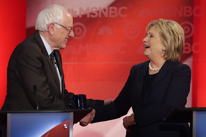 Democratic presidential candidate Sen. Bernie Sanders, I-Vt., and Democratic presidential candidate Hillary Clinton shake hands after a Democratic presidential primary debate hosted by MSNBC at the University of New Hampshire Thursday, Feb. 4, 2016, in Durham, N.H.