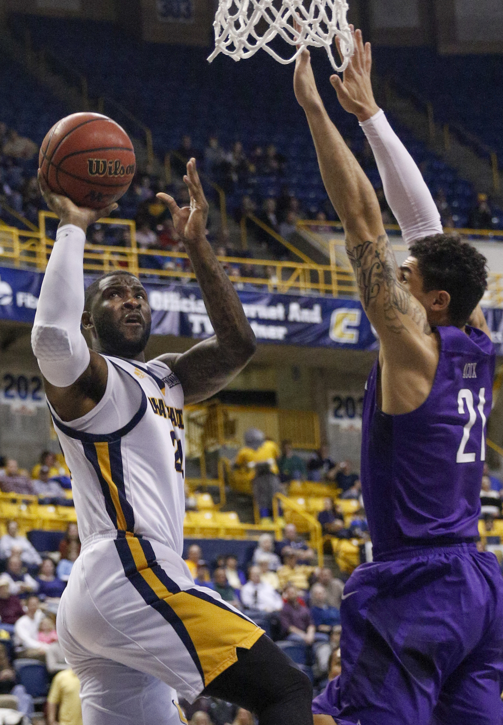 UTC forward Duke Ethridge shoots around Furman forward Kris Acox during the Mocs' home basketball game against the Paladins at McKenzie Arena on Saturday, Feb. 6, 2016, in Chattanooga, Tenn.