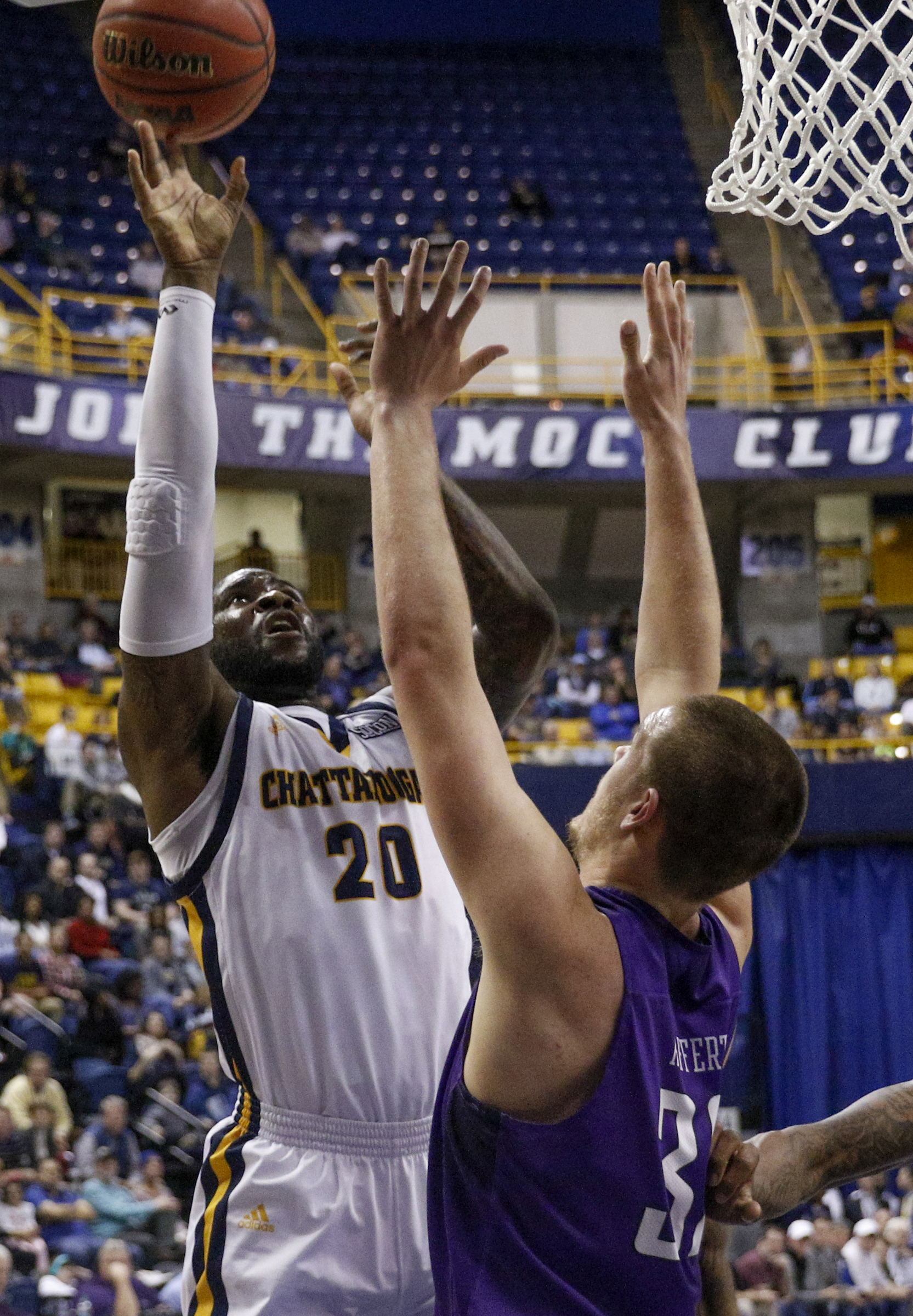 UTC forward Duke Ethridge shoots over Furman forward Matt Rafferty during the Mocs' home basketball game against the Paladins at McKenzie Arena on Saturday, Feb. 6, 2016, in Chattanooga, Tenn.