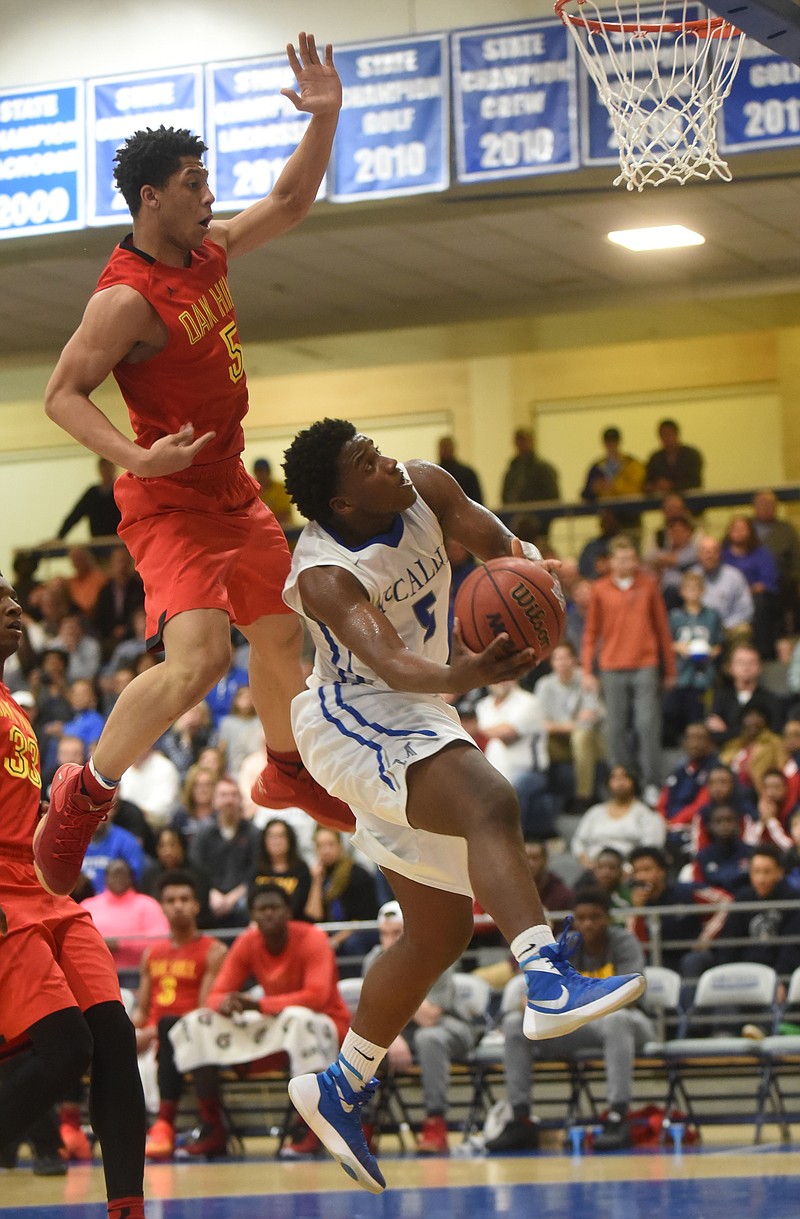 McCallie's Adrian Thomas shoots as Oak Hill's Lindell Wigginton leaps behind him Friday, February 5, 2016 at McCallie.