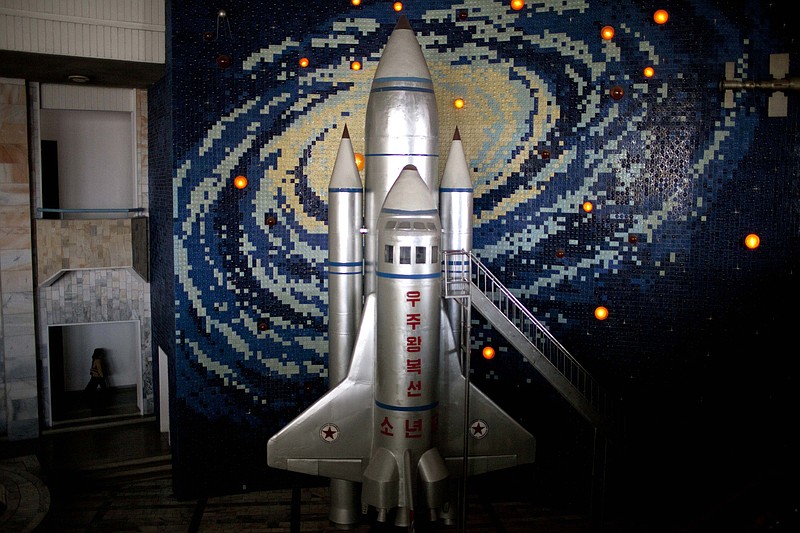 
              FILE - In this April 18, 2013, file photo, a model of a space shuttle is displayed in the lobby of the Mangyongdae Children's Palace in Pyongyang, North Korea. Words on the space shuttle reads "Roundtrip path to space" and "youth" on the bottom. The Unha 3 rocket that launched the “Bright Star” satellite into space in 2012 is a symbol of North Korea’s technological successes and a matter of great national pride. The country plans another launch to put Earth observation satellite into orbit in February, 2016. Although the equipment it will use is not yet known, the launch could also advance its military-use missile technology further. (AP Photo/Alexander F. Yuan, File)
            