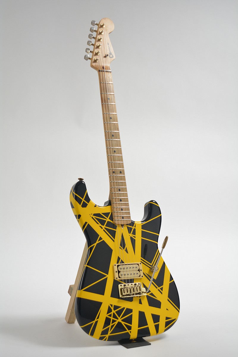 
              This undated photo provided by Guernsey’s auction house shows a yellow-and-black Charvel guitar, customized for Eddie Van Halen in the 1980s It could bring $60,000 to $80,000 when it goes up for sale on Feb. 27, 2016, in New York. (Guernsey’s via AP)
            