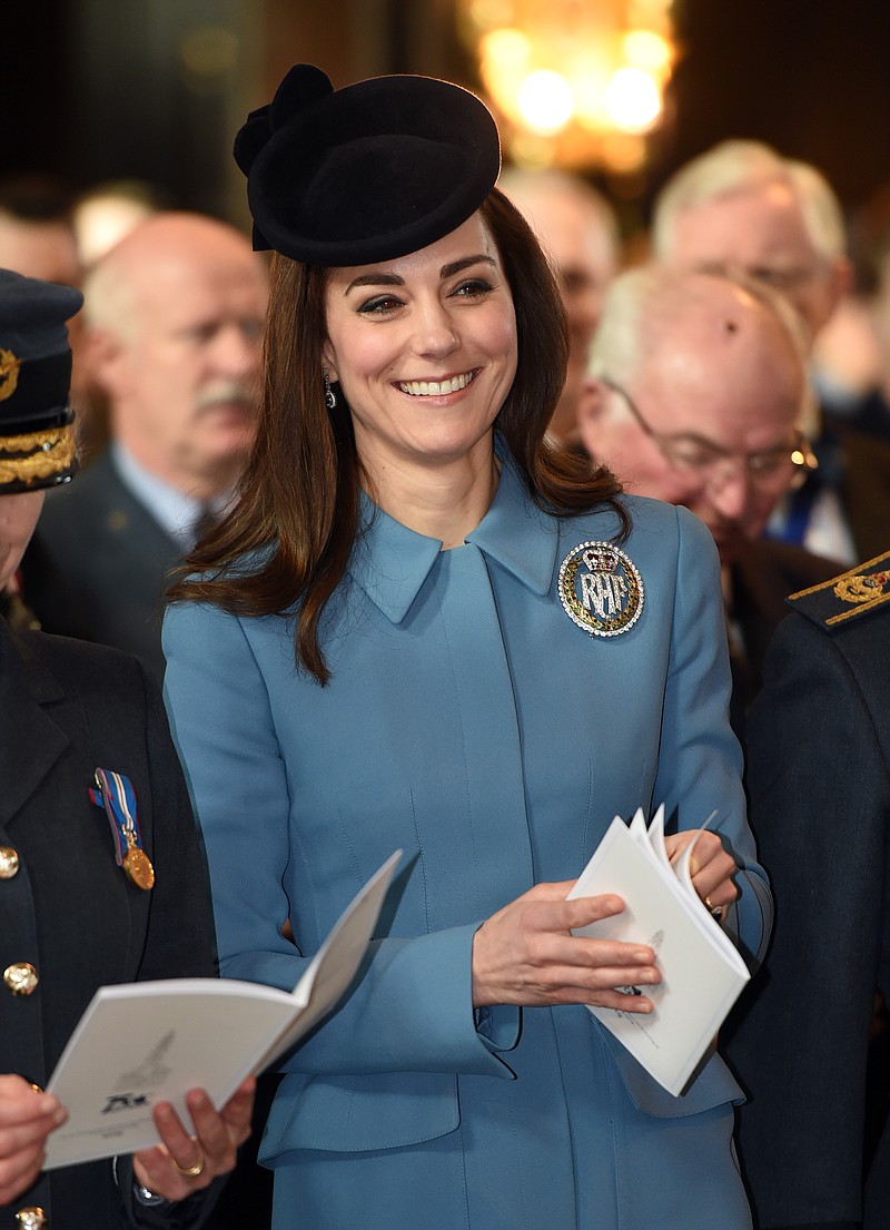 
              Britain's Kate, the Duchess of Cambridge smiles as she attends a service at RAF church St Clement Danes, to mark the 75th anniversary year of the RAF Air Cadets, in London, Sunday, Feb. 7, 2016. (Eddie Mulholland/Pool Photo via AP)
            