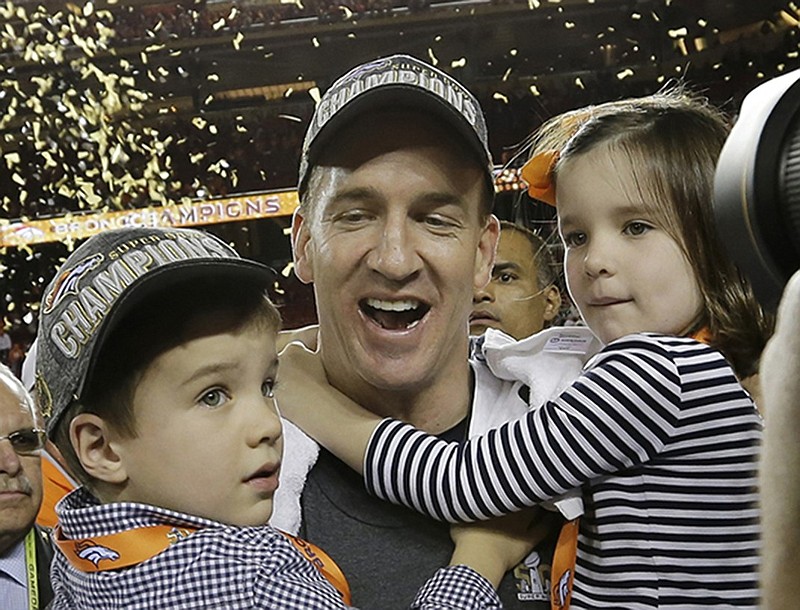 Denver Broncos’ Peyton Manning (18) celebrates with his son Marshall and daughter Mosley after the NFL Super Bowl 50 football game Sunday, Feb. 7, 2016, in Santa Clara, Calif. The Broncos won 24-10. (AP Photo/David J. Phillip)