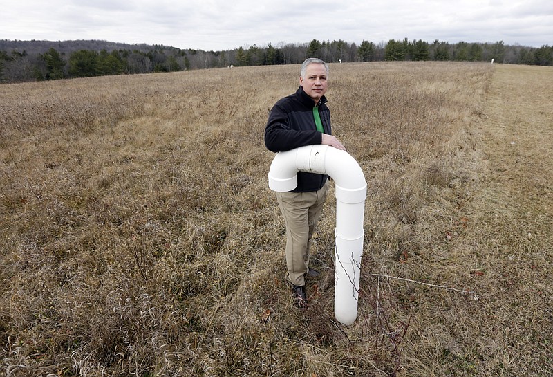 
              In this Friday, Dec. 18, 2015, photo, Nassau Town Supervisor David Fleming poses at the town landfill in Nassau, N.Y. The town proposes to be off the grid and to power its six buildings with solar, wind power and other renewable resources by 2020. (AP Photo/Mike Groll)
            