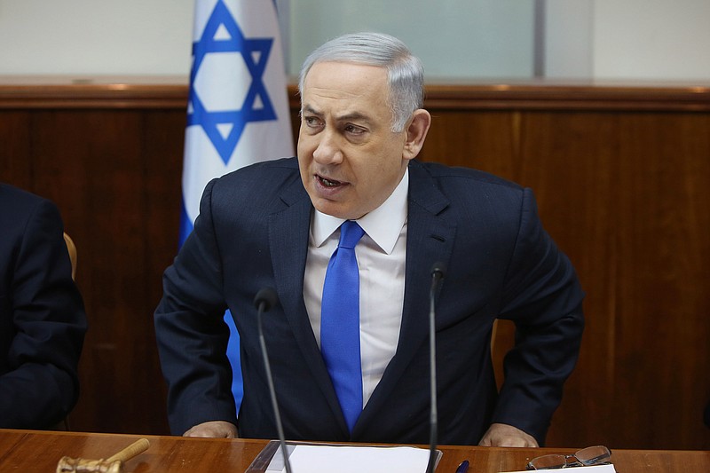 
              Israeli Prime Minister Benjamin Netanyahu opens the weekly cabinet meeting at his Jerusalem office on Sunday,  Feb. 7, 2016. (Gali Tibbon/Pool via AP)
            