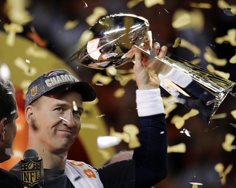 
              Denver Broncos’ Peyton Manning holds up the trophy after the NFL Super Bowl 50 football game Sunday, Feb. 7, 2016, in Santa Clara, Calif. The Broncos won 24-10. (AP Photo/Matt York)
            