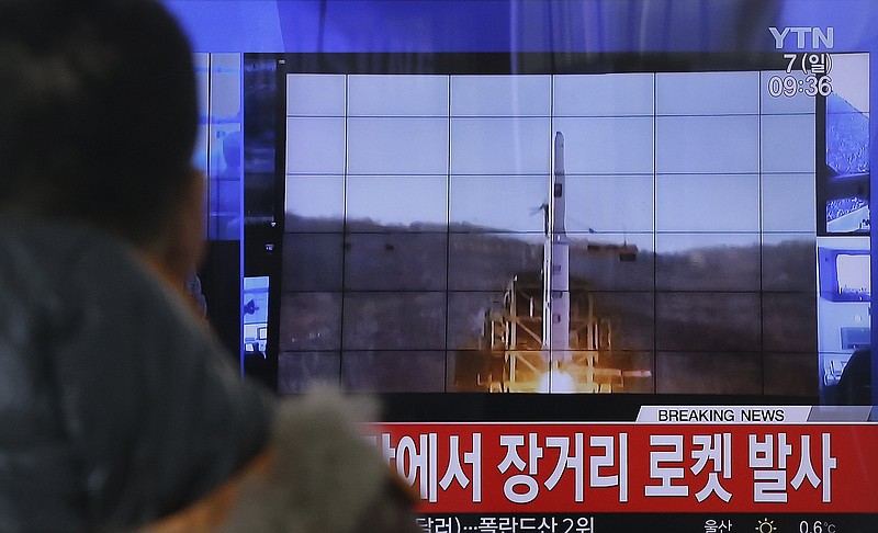 
              A South Korean man watches a TV news program with a file footage about North Korea's rocket launch at Seoul Railway Station in Seoul, South Korea, Sunday, Feb. 7, 2016. North Korea on Sunday defied international warnings and launched a long-range rocket that the United Nations and others call a cover for a banned test of technology for a missile that could strike the U.S. mainland. The letters on the screen read: "North Korea launched a long-range rocket." (AP Photo/Ahn Young-joon)
            